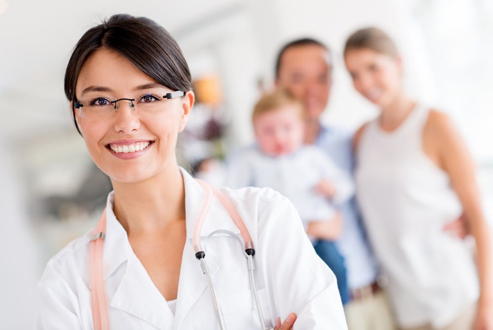 Friendly family doctor at the hospital looking happy Friendly family doctor at the hospital looking happy
